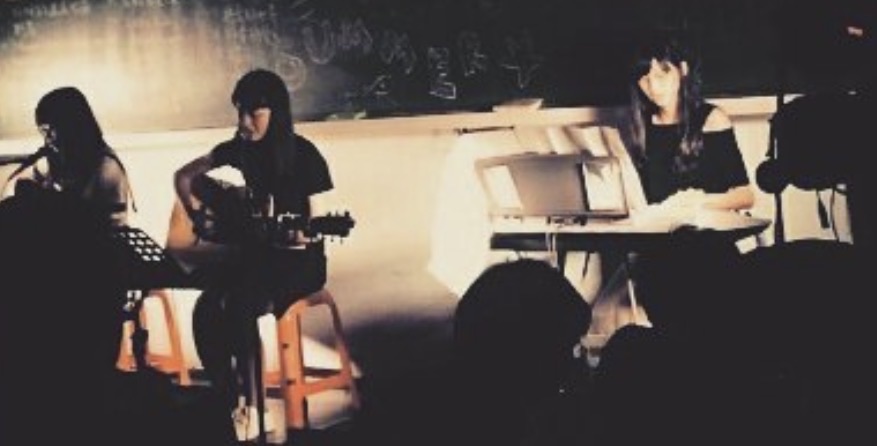 University guitar club performance with guitar and keyboard players